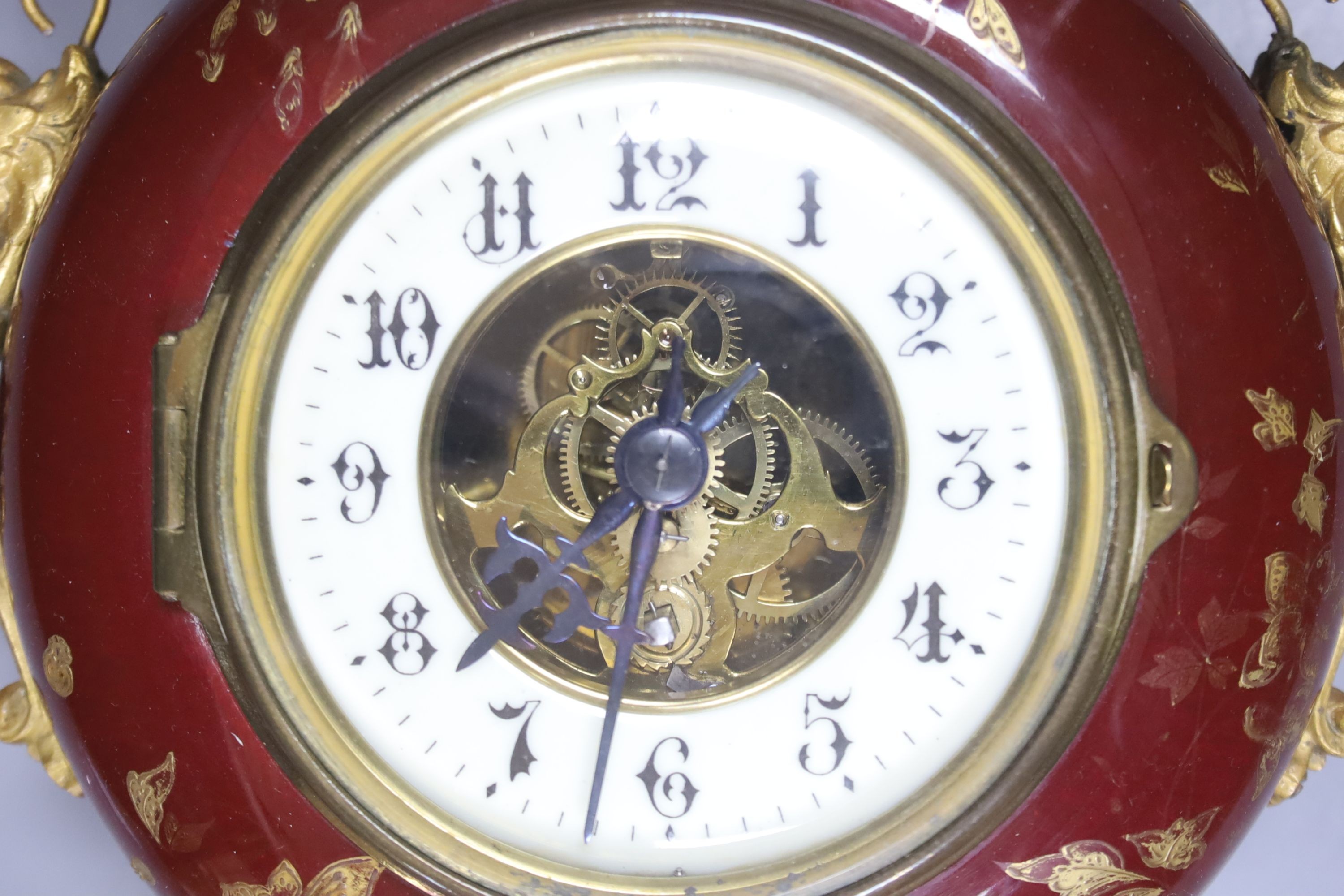 A French pottery and gilt metal cartel timepiece, height 38cm